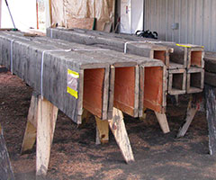 stained-faux-beams Large raw wood solid beams in production